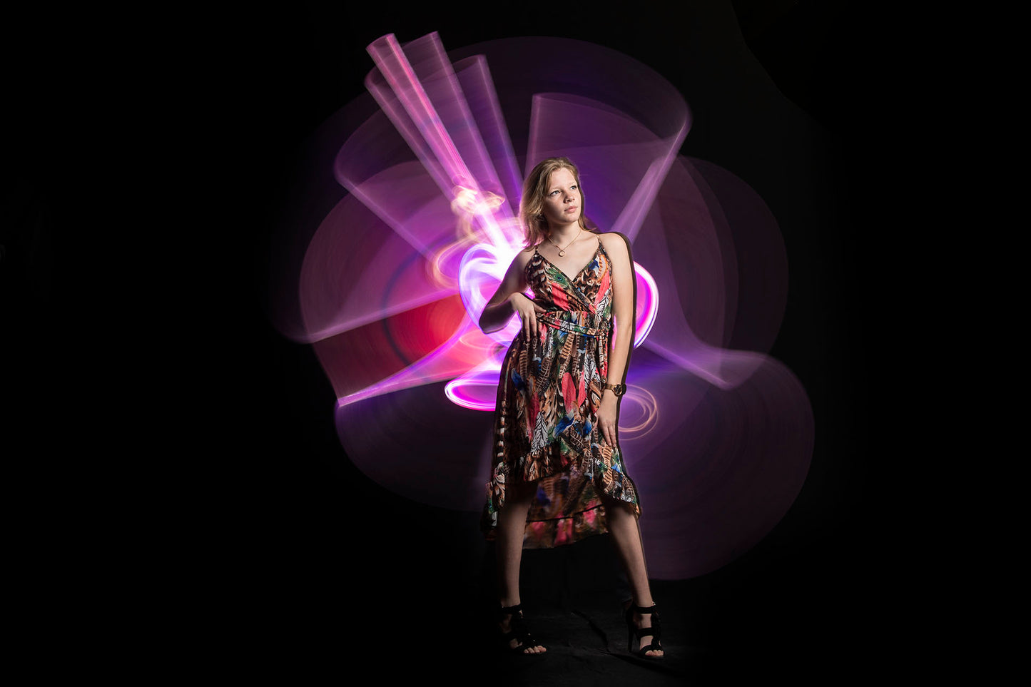 Light tube painting with model in studio long exposure royal blue