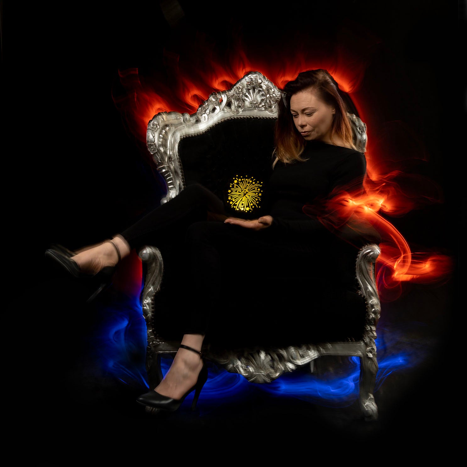 model in chair with fire and colors plus startdust