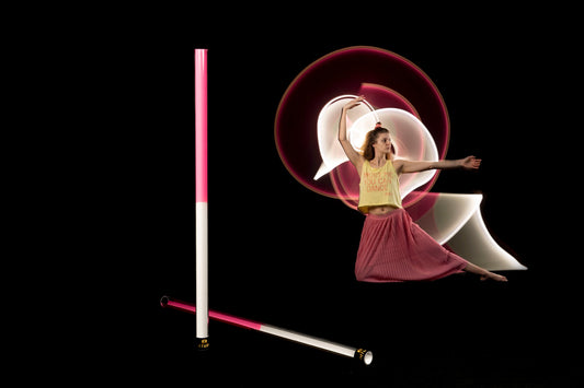 dancing girl with light tube painting travel tube pink and white